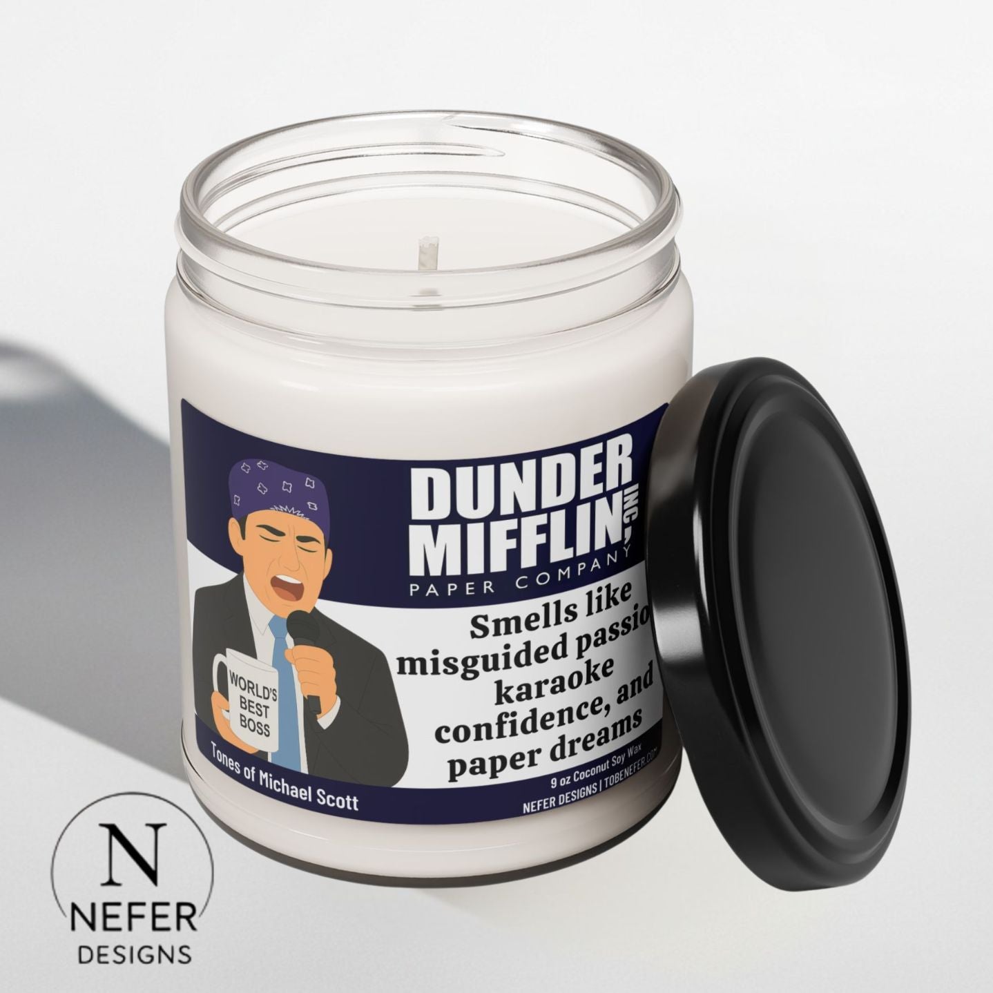 Candle in a jar with a labeled design featuring a character from 'The Office' on a white background.
