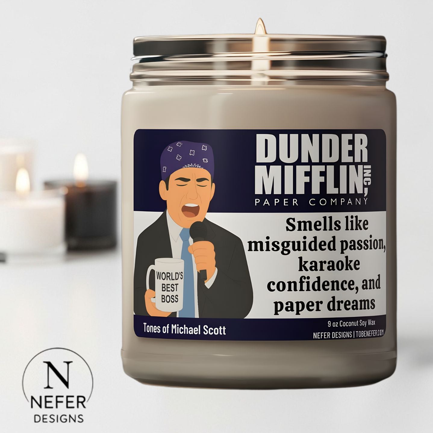 Candle with a label featuring Michael Scott character from 'The Office' and the text 'Dunder Mifflin'.