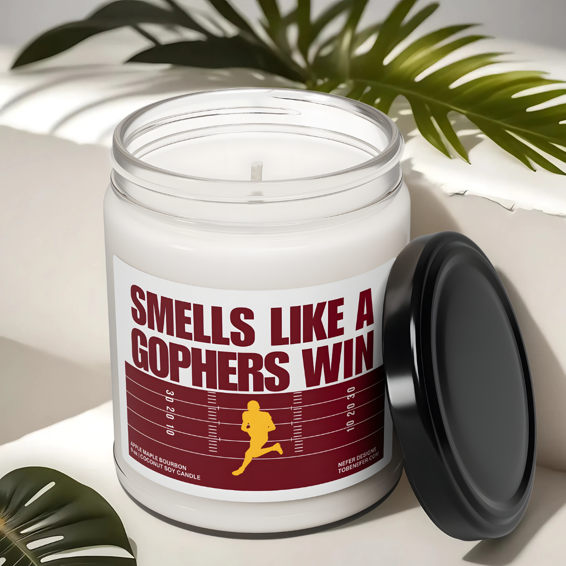 Gophers game day candle with the themed colors on the label