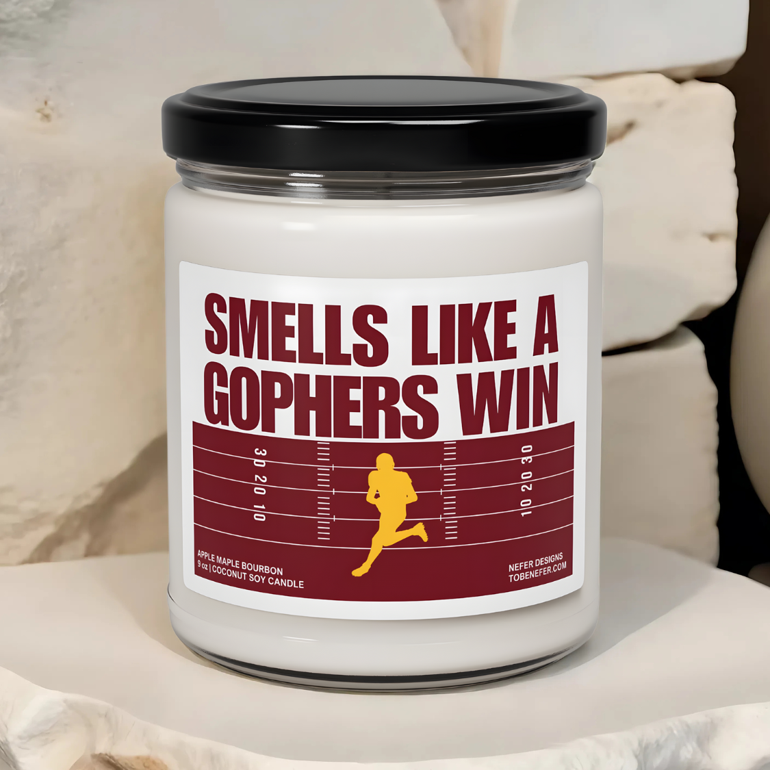 Gophers game day candle with the themed colors on the label