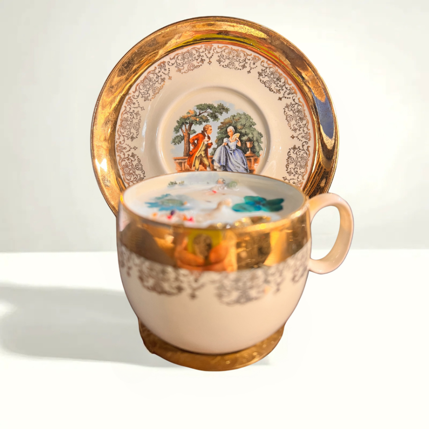 Sabin Crest teacup and saucer set depicting George and Martha Washington with 18th-century-inspired artwork, gold trim, and patriotic motifs.